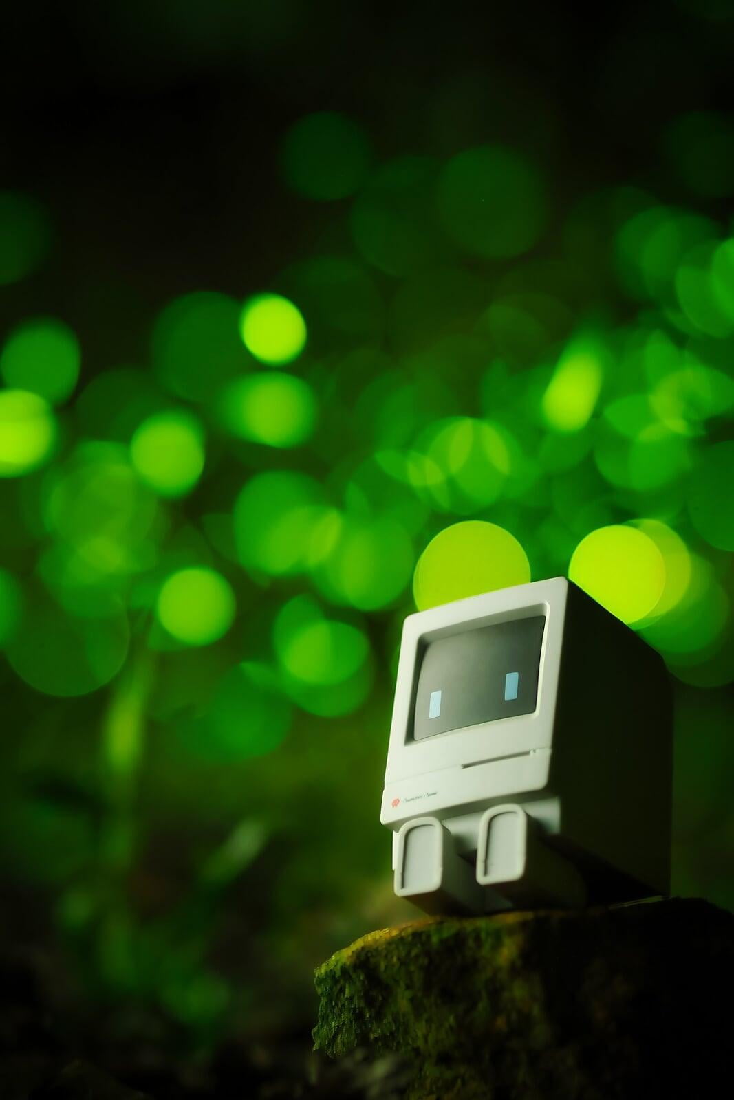 Animated computer character, sitting on a stump.